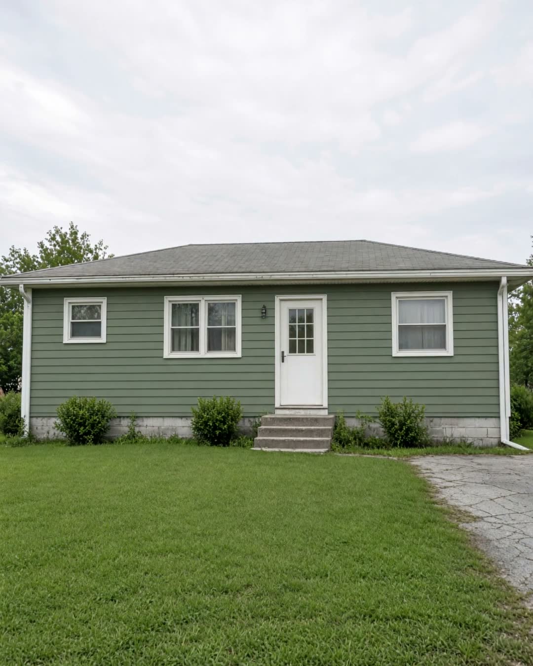 The same house in new sage-green siding